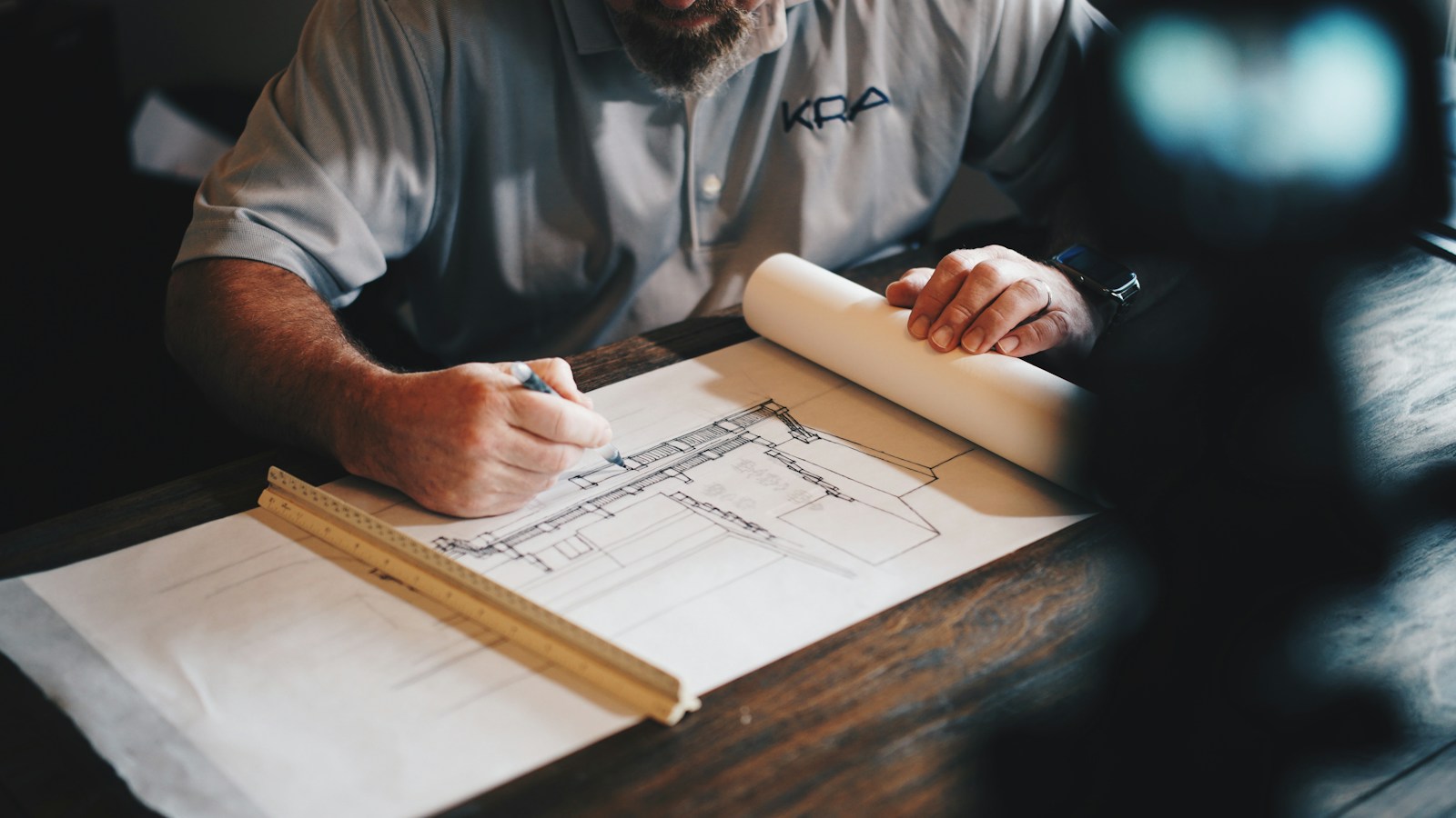 An architect's plans spread out for a residential project